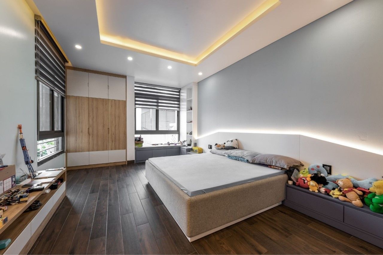Phòng ngủ bé tông màu xám nhẹ nhàng sư dụng nội thất gỗ màu sáng trẻ trung